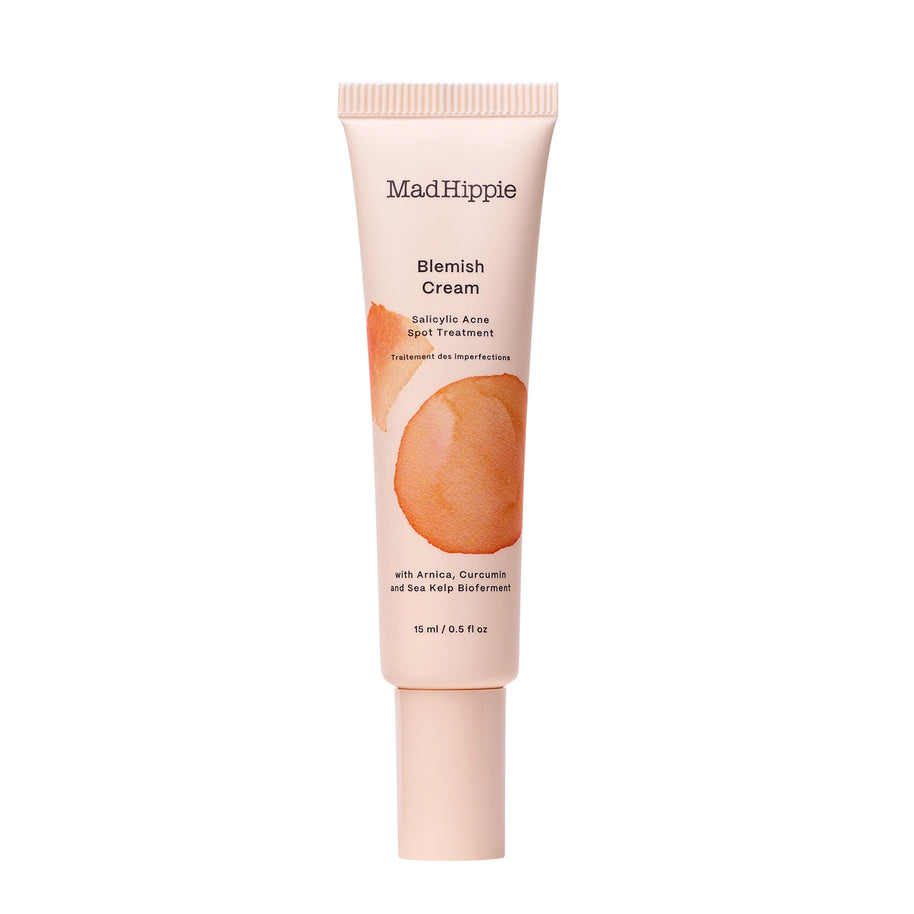 Blush pink tube of MadHippie Blemish Cream with orange circular watercolor design and salicylic acid spot treatment text