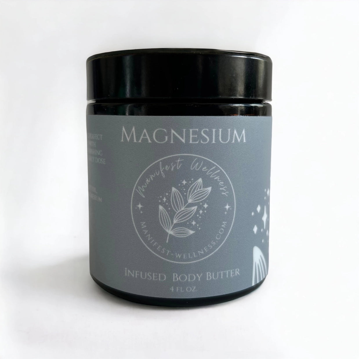 Dark amber glass jar with black lid containing magnesium-infused body butter, gray label with botanical leaf design, 4 oz.