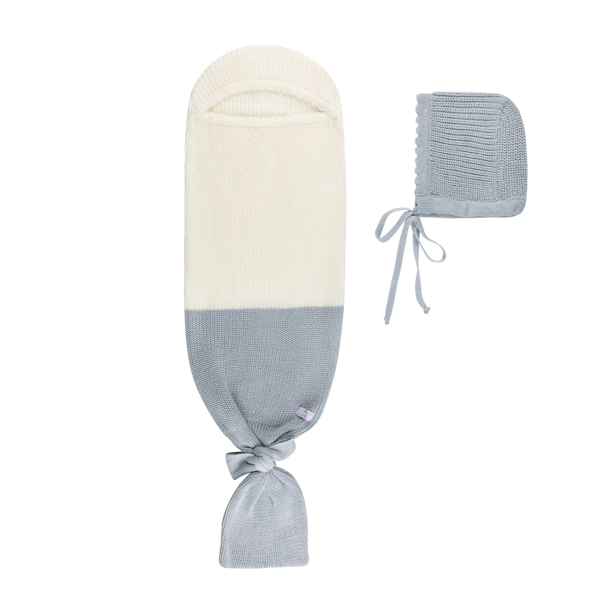 Knitted baby cocoon sleep sack in cream and dusty blue with matching bonnet, tie closures at hood and bottom