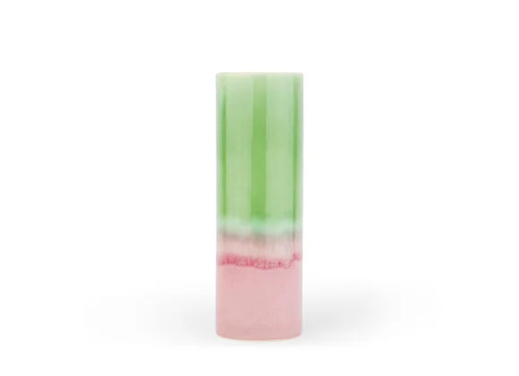 Cylindrical layered soap bar with translucent mint green top half and opaque soft pink bottom separated by white band
