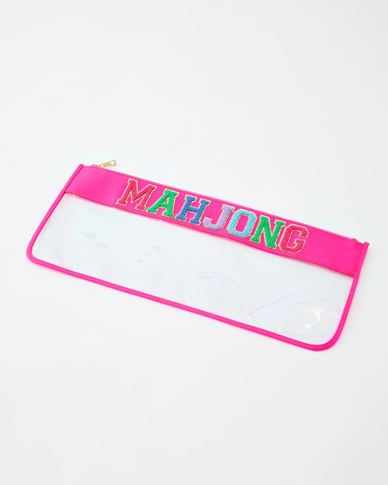 Clear vinyl pencil case with hot pink trim and multicolored glitter MAHJONG lettering across top with gold zipper