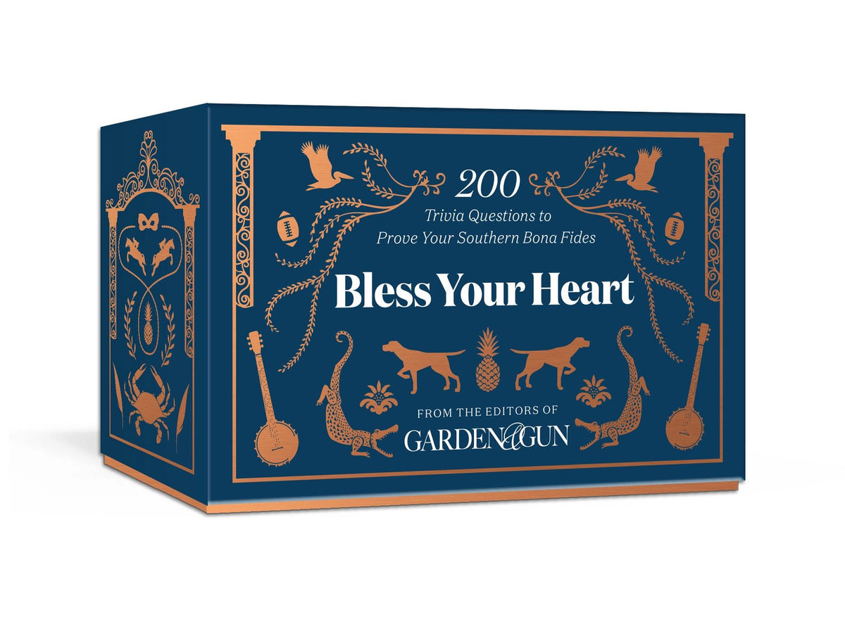 Navy blue trivia card box with copper Southern-themed illustrations including dogs, banjos, pineapple, and decorative flourishes