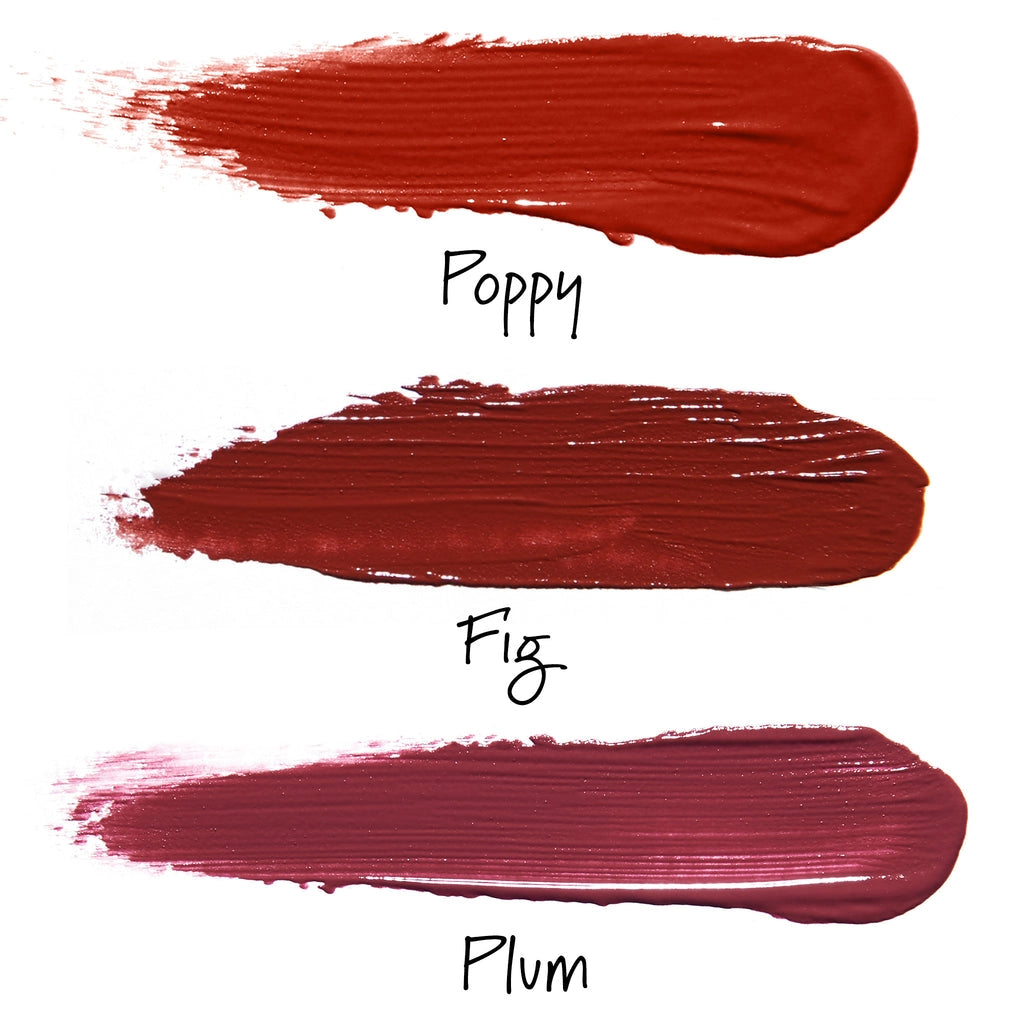 Three lip color swatches in Poppy bright red, Fig deep burgundy, and Plum wine shades with visible brush texture