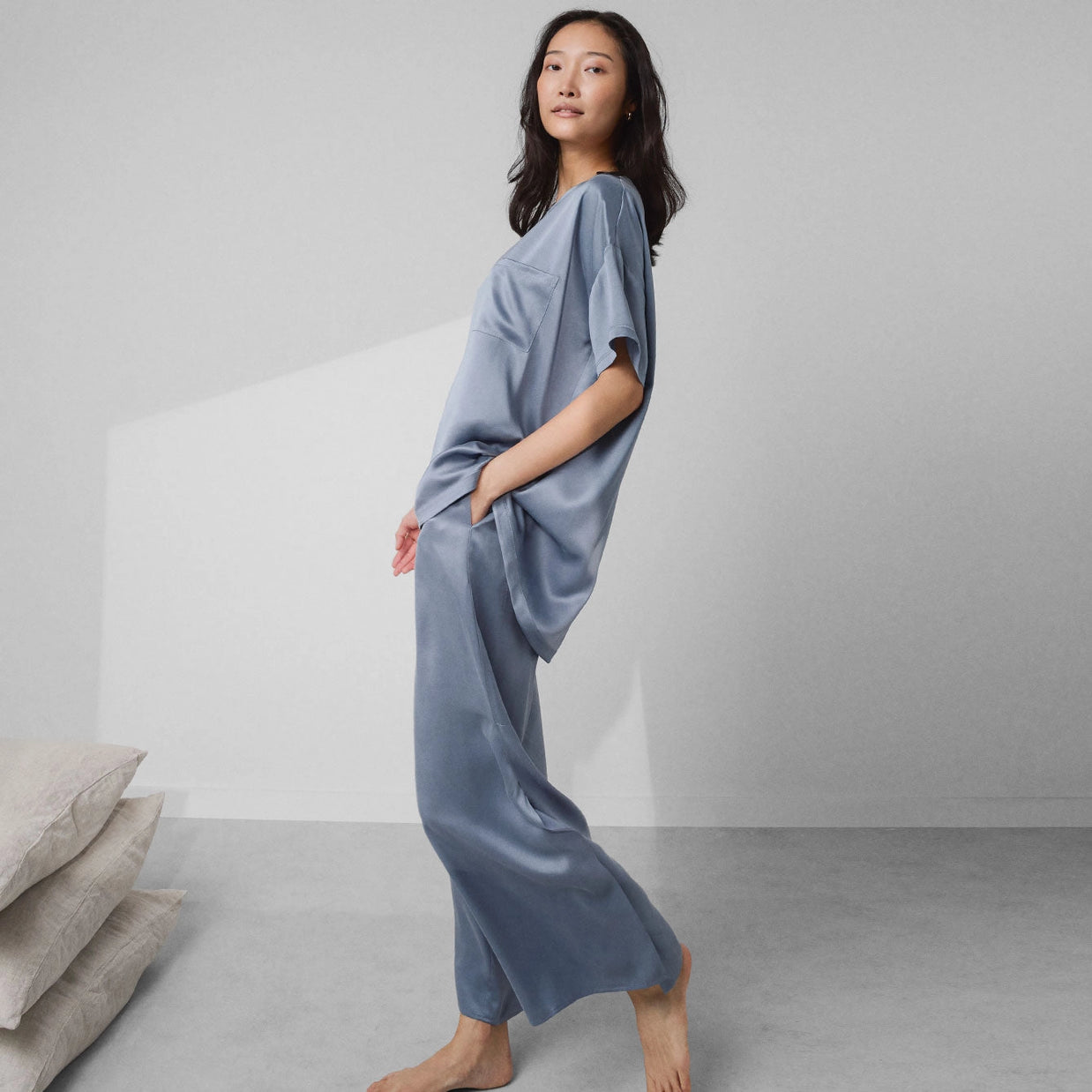 Dusty blue washable silk pajama set with relaxed-fit short sleeve tee and wide-leg pants with side pockets