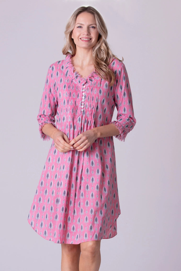 Pink cotton tunic dress with gray teardrop print, pintuck pleating, ruffled V-neck, and three-quarter sleeves