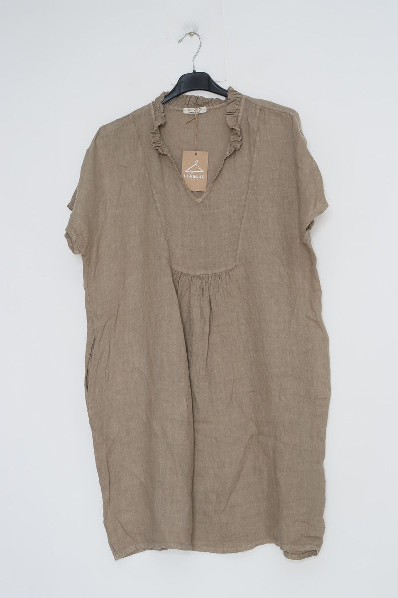 Taupe linen short-sleeve dress with ruffled V-neckline and gathered empire waist hanging on black hanger with tag attached