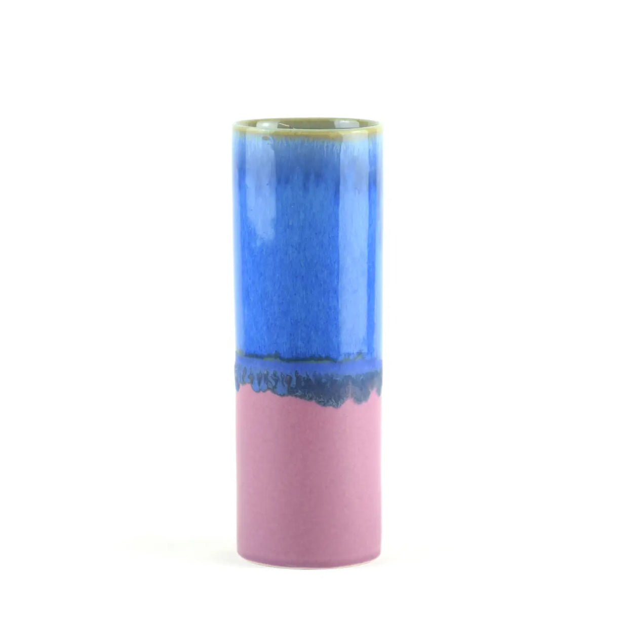 Cylindrical ceramic vase with periwinkle blue glaze on top half, mauve pink bottom, and olive green glazed rim with drip effect