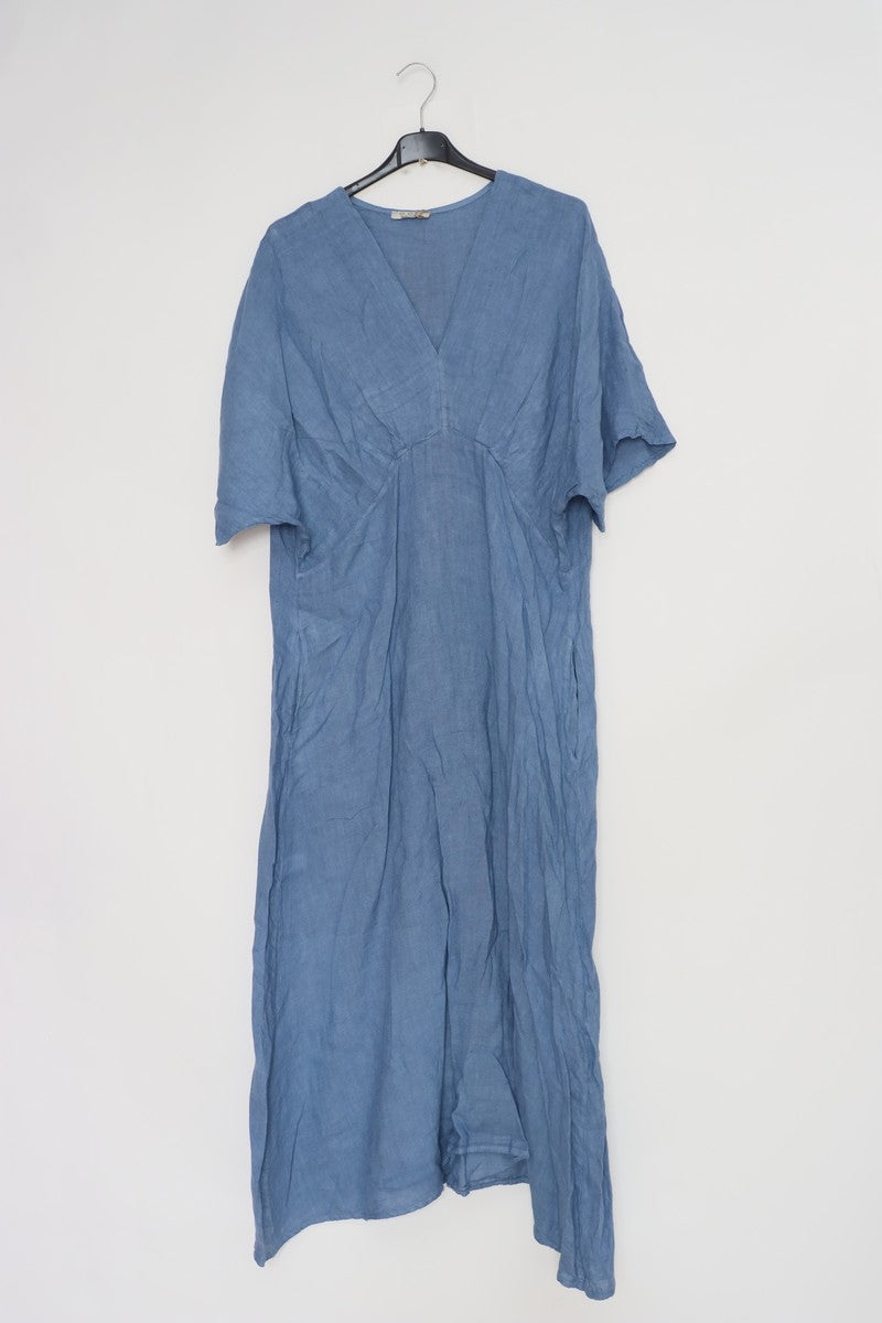 Dusty blue linen caftan dress with V-neck, kimono sleeves, and relaxed flowing silhouette hanging on black hanger