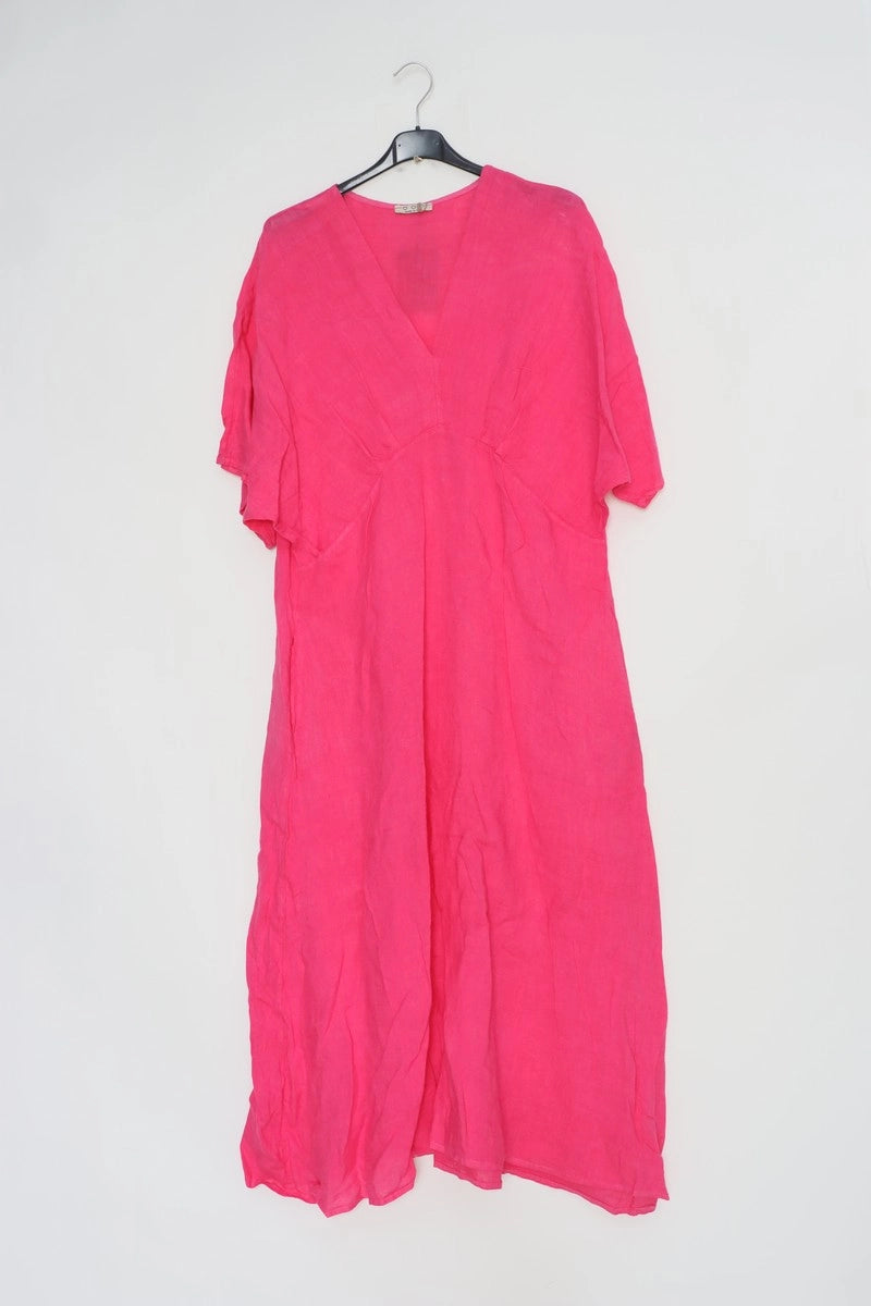 Hot pink linen caftan dress with deep V-neck, kimono sleeves, and relaxed A-line silhouette on black hanger