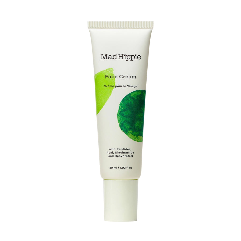 White squeeze tube of MadHippie Face Cream with abstract lime green and dark green watercolor leaf design, 30ml size