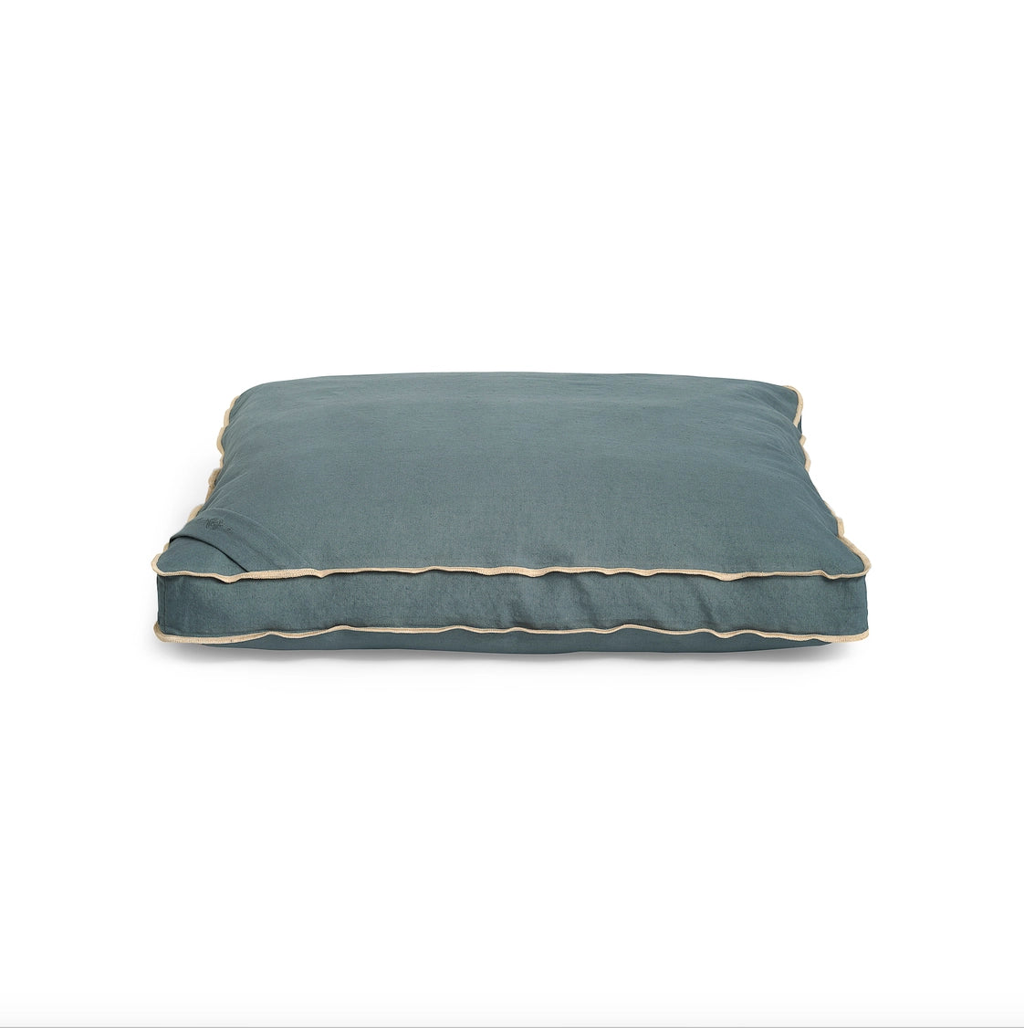 Slate blue meditation cushion with beige piped trim, rectangular shape with gusseted edges and soft fabric cover