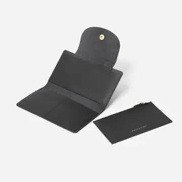 Black leather card holder wallet opened to show interior compartments with snap closure and separate slim cardholder piece