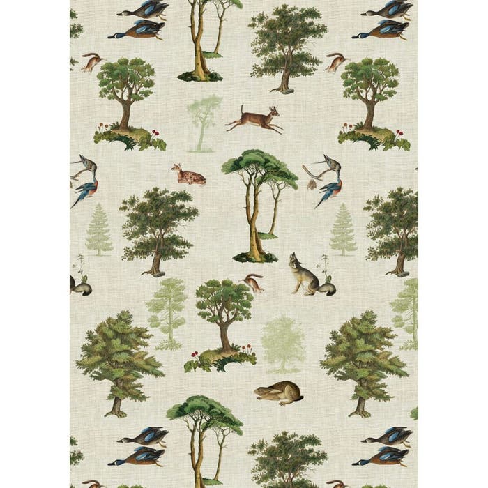Natural linen kitchen towel with woodland pattern featuring green trees, leaping deer, blue birds, and forest animals.