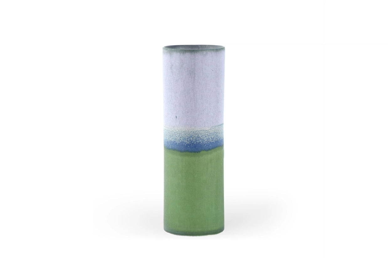 Tall cylindrical ceramic vase with lavender upper half and sage green lower half separated by blue gradient drip glaze