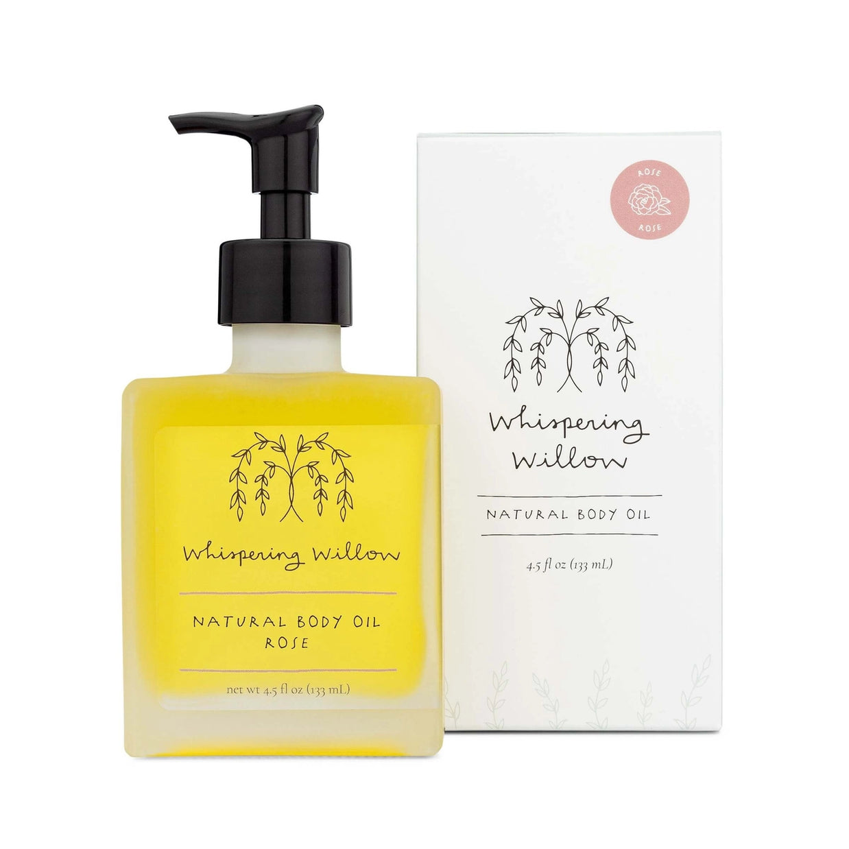 Square glass bottle with black pump dispenser containing golden yellow rose body oil beside white minimalist packaging box