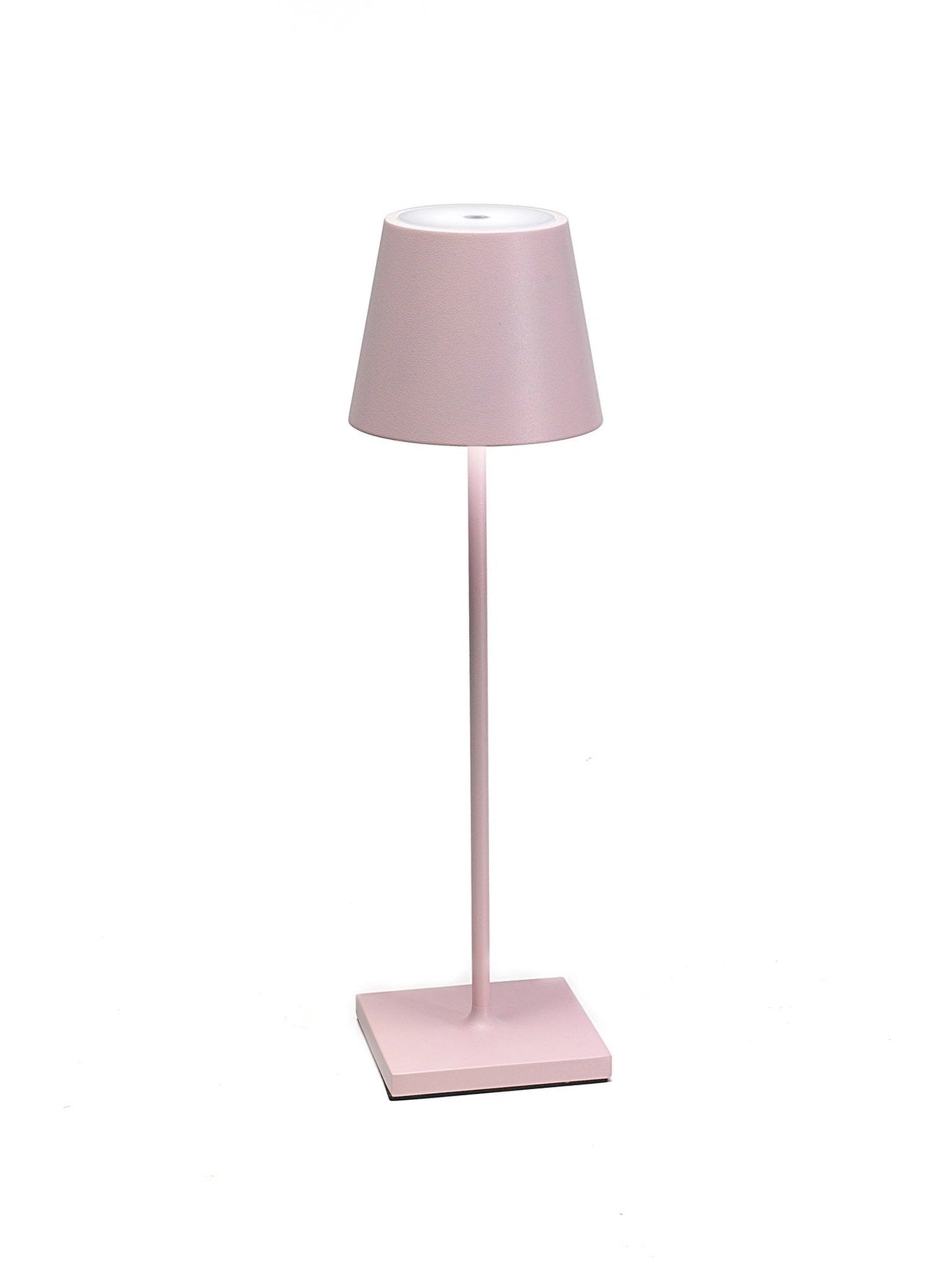 Cordless LED table lamp in soft pink with tapered fabric shade, slender stem, and square base on white background