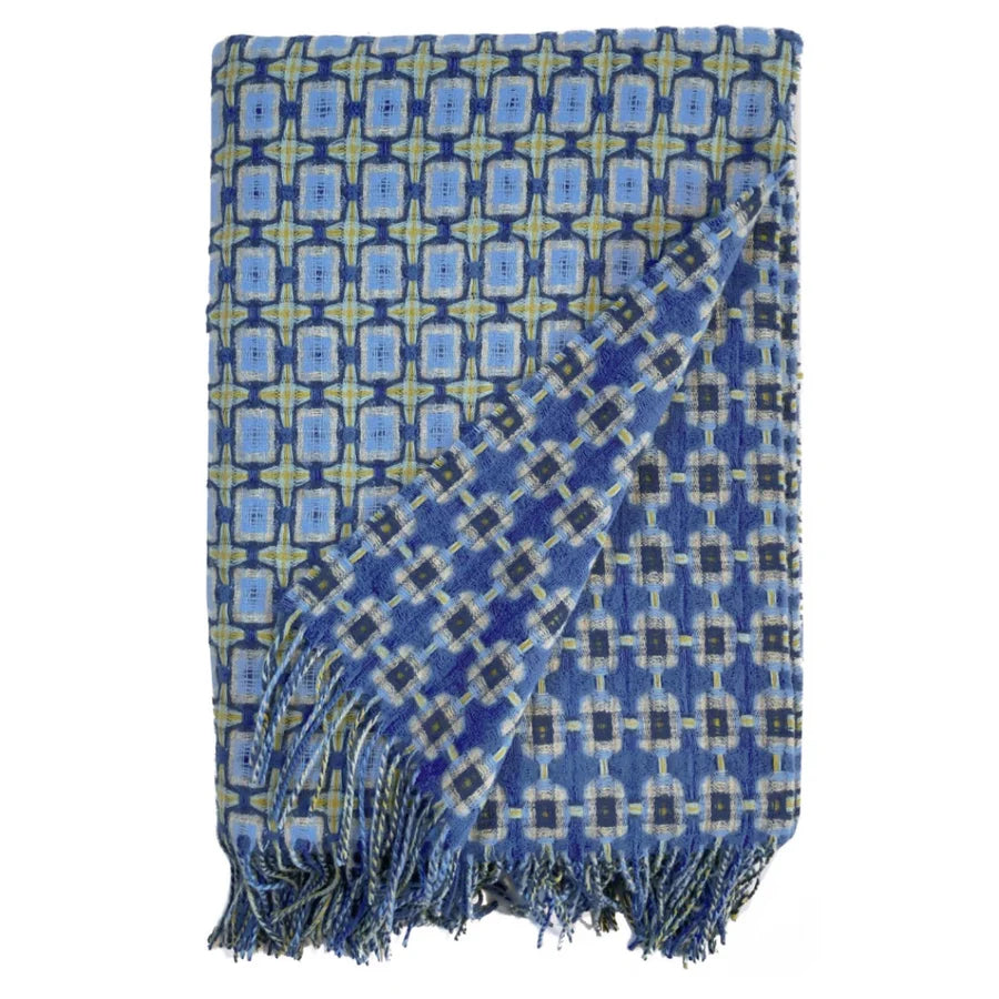 Woven wool throw blanket in blue, navy and chartreuse geometric pattern with long twisted fringe on two ends